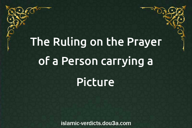 The Ruling on the Prayer of a Person carrying a Picture